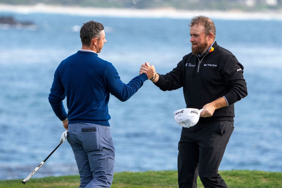 Rory McIlroy (left) is congratulated by Shane Lowry (right) for winning on the 18th hole during the final round of the AT&T Pebble Beach Pro-Am golf tournament at Pebble Beach Golf Links. Picture Credit: Kyle Terada-Imagn Images
